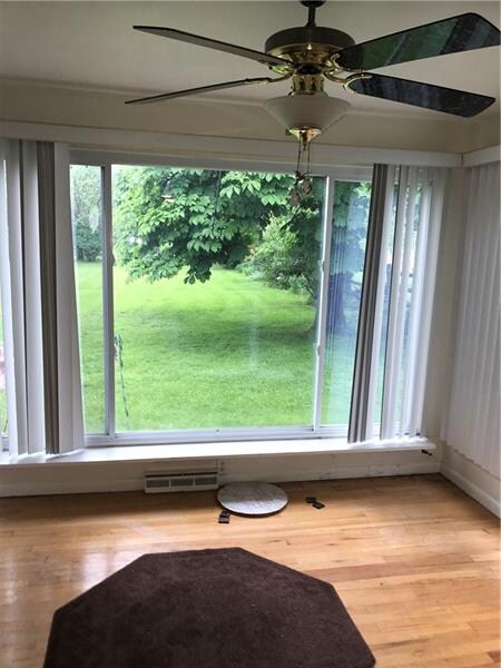 Sunroom with view of back yard.