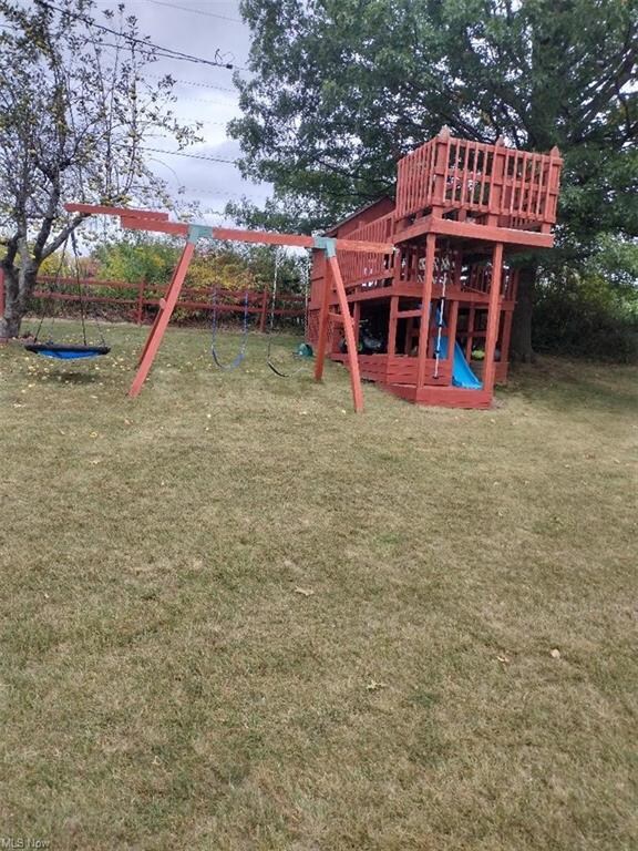 View of play area featuring a lawn