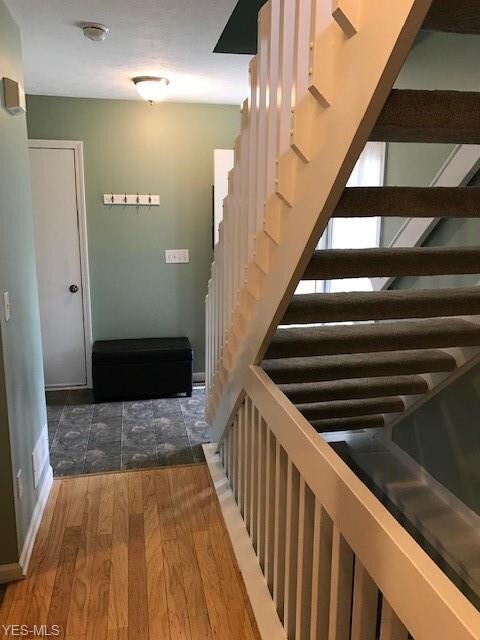 DOOR LEADS TO GARAGE - HARDWOOD FLRG IN GRT RM/DIN