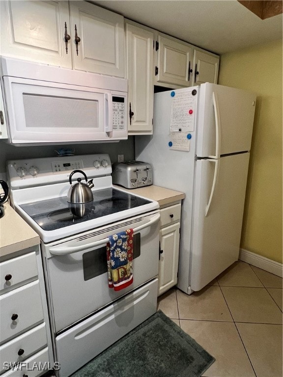 Kitchen featuring light tile patterned flooring, f