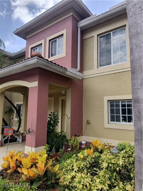 View of front facade featuring stucco siding