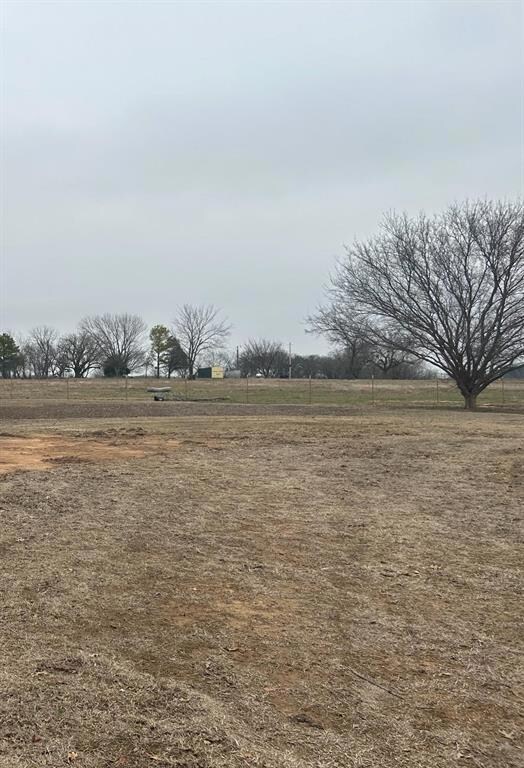 View of yard with a rural view