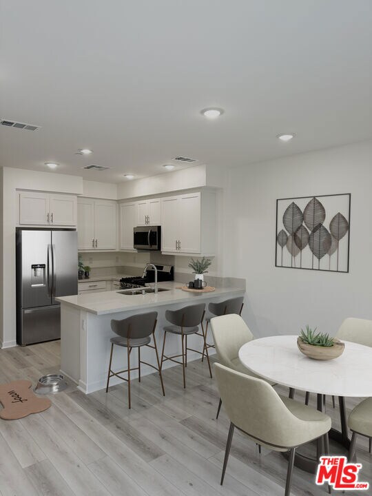 Plan B6 kitchen and dining area. Furniture and ref
