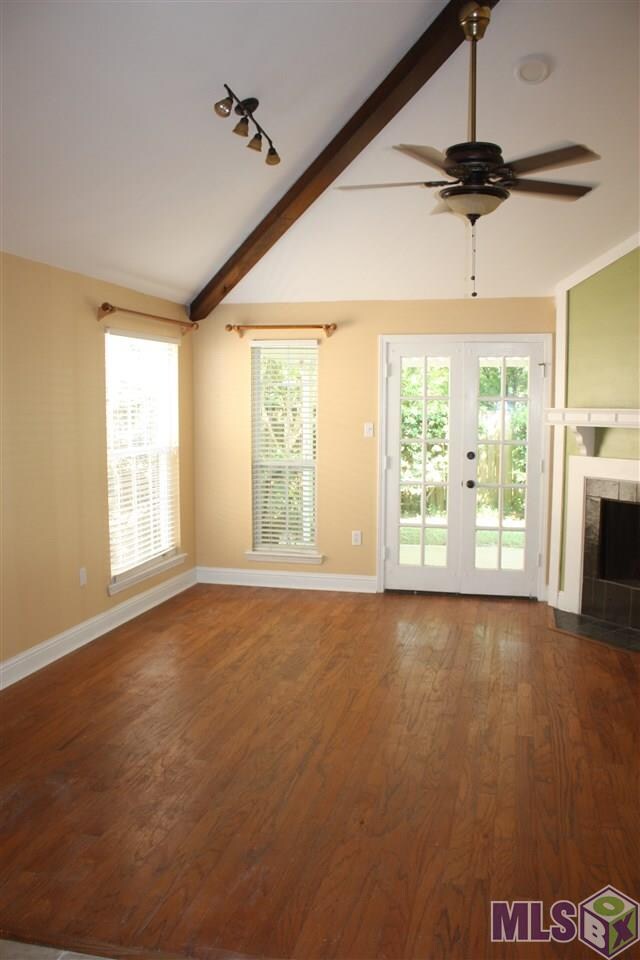 Beautiful rich wood floors.  Nice french doors ove