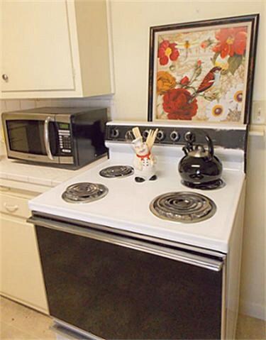 Full size cooking stove, oven and  like new microwave provided.