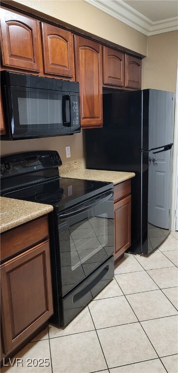 Kitchen with light countertops, light tile pattern