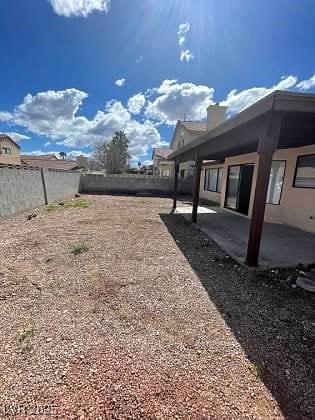 Fenced backyard featuring a patio area