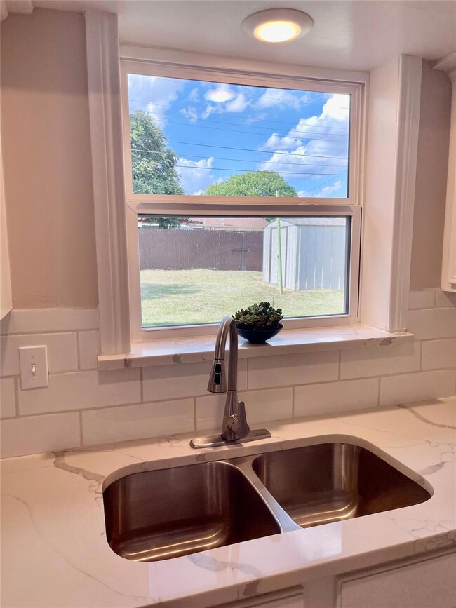 Interior details featuring light stone counters, s