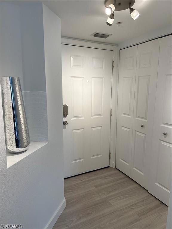 Entryway with wood finished floors