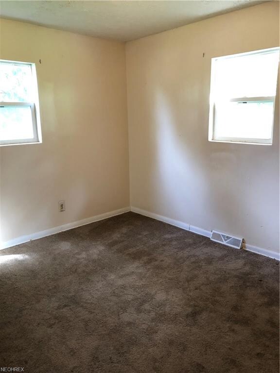 Bedroom 1 has 2 windows and a built in desk.