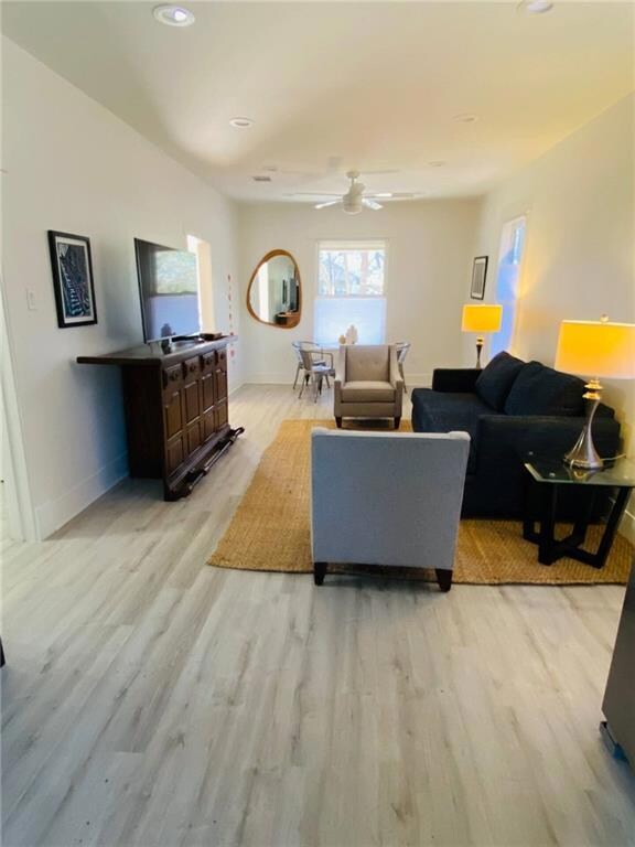 Living area with baseboards, ceiling fan, recesse