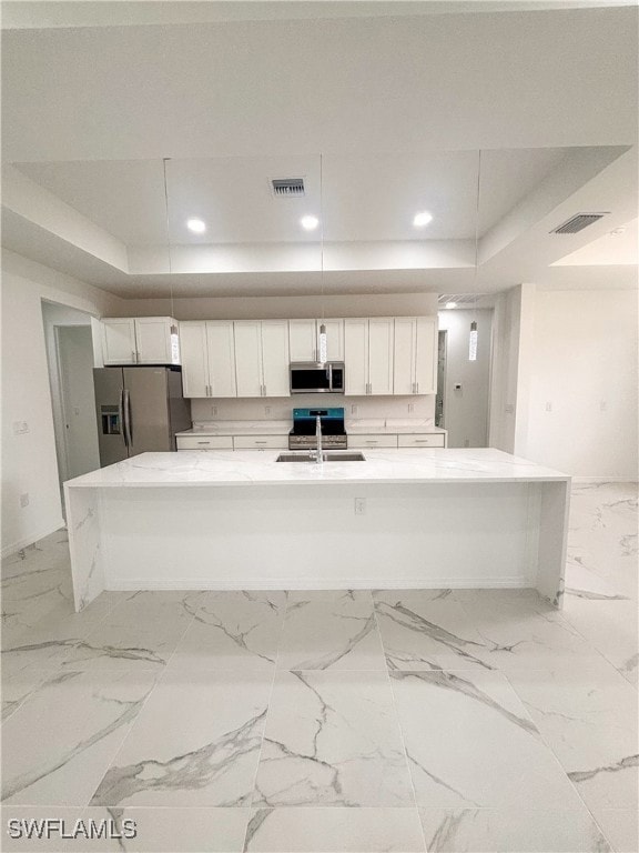 Kitchen with appliances with stainless steel finis