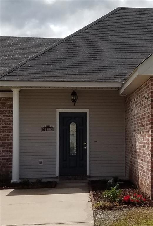 Freshley landscaped, painted front door and pressu