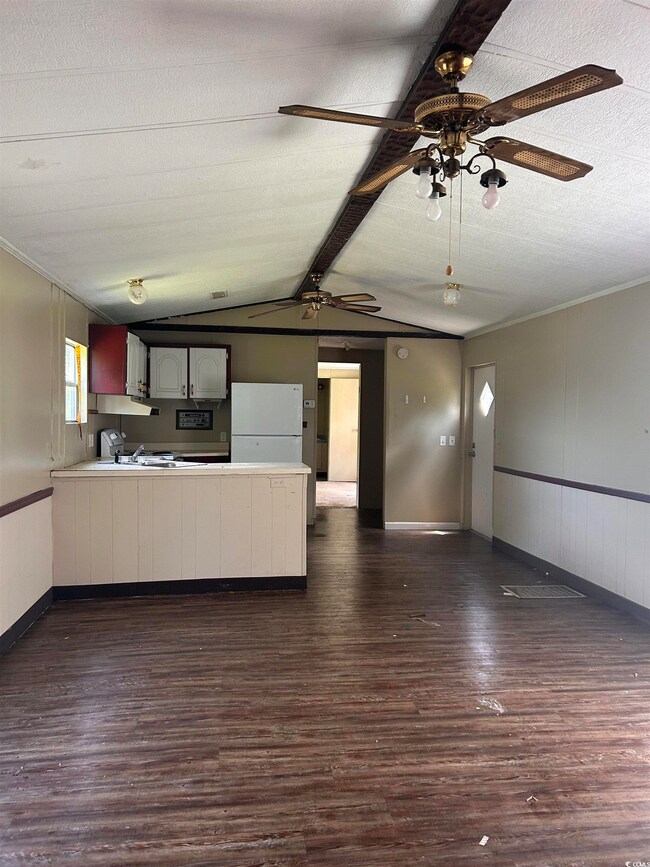 Kitchen featuring dark hardwood / wood-style floor