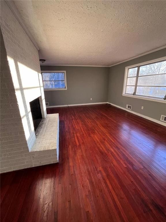 Unfurnished living room featuring crown molding, a