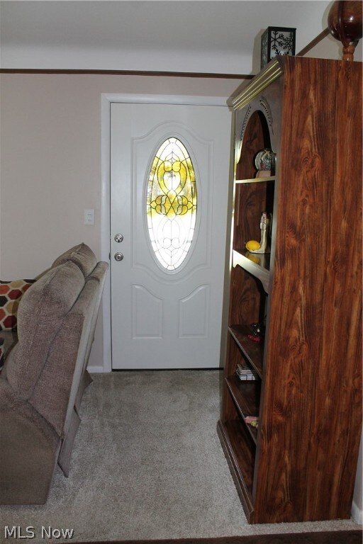 View of carpeted foyer entrance