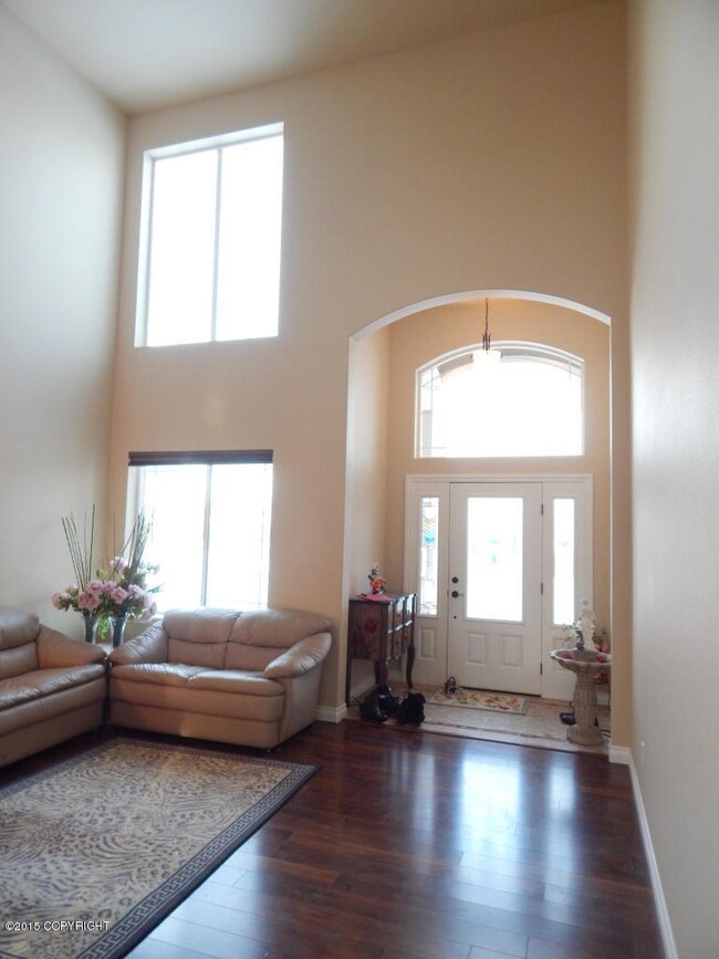 Tile Entry With 2 Story Ceiling