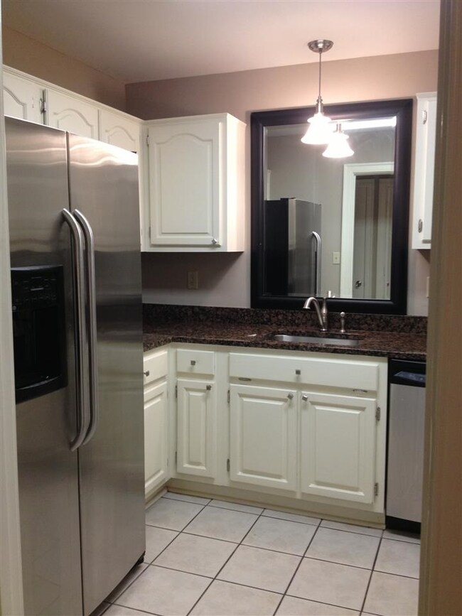 Kitchen with granite and stainless steel appliance