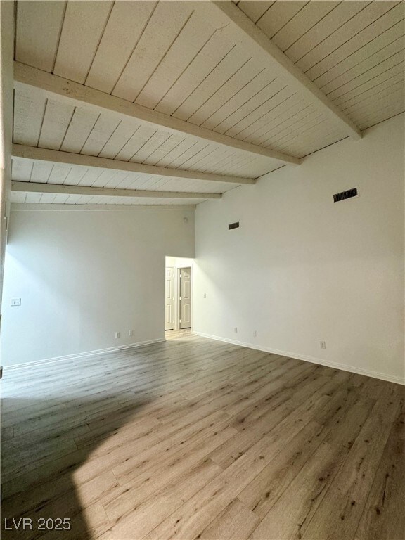 Living room with baseboards, wood finished floors,