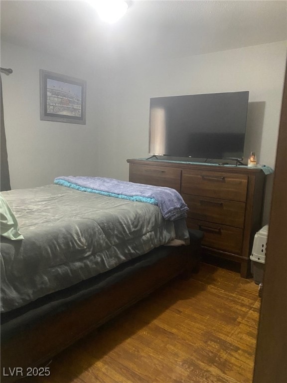 Bedroom with dark wood finished floors