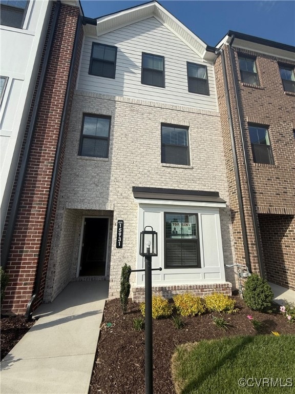 View of front of home with brick siding