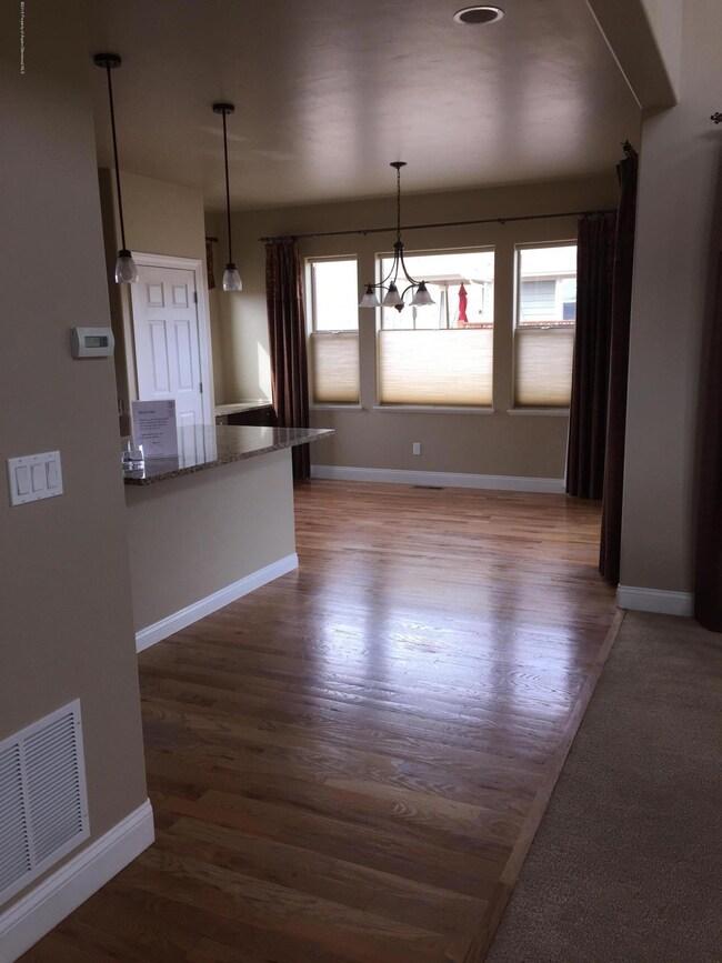 view from entry into open kitchen-dining