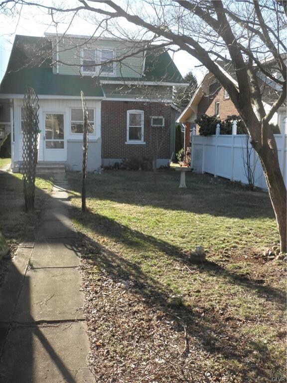 Facing back of home-- walk way also goes around th