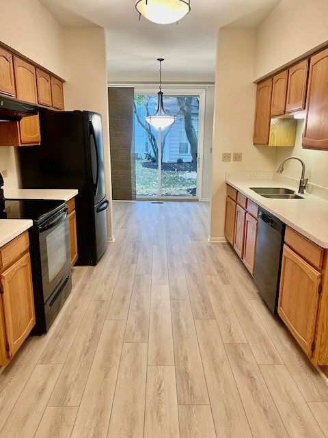 Wide galley kitchen with eating areas on both ends