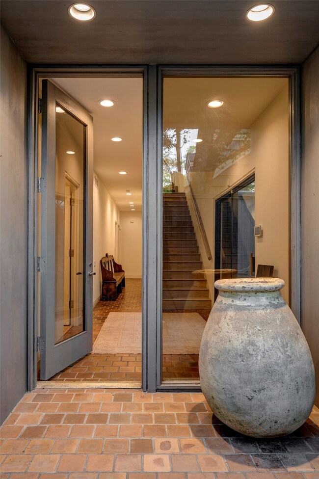 The front door opens to a spacious entry leading t