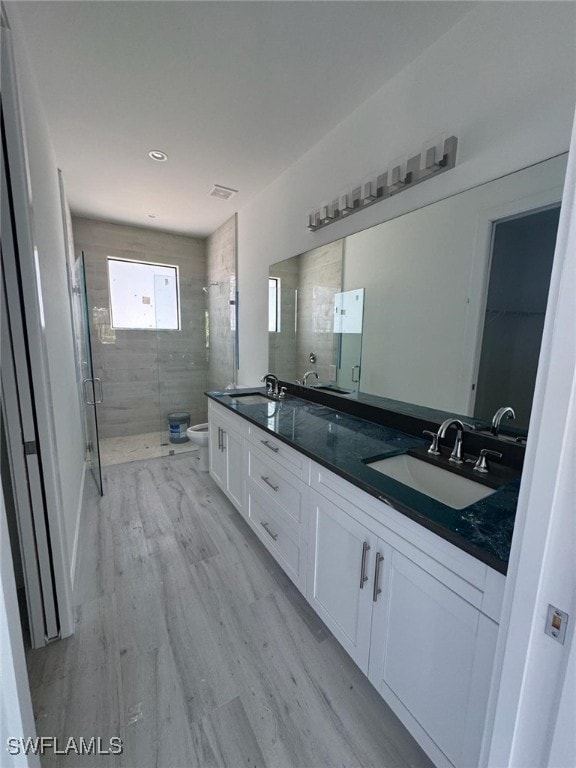 Full master bathroom featuring double vanity and a