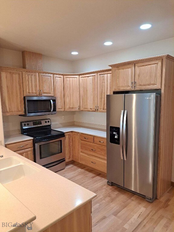 Kitchen featuring light hardwood / wood-style floo
