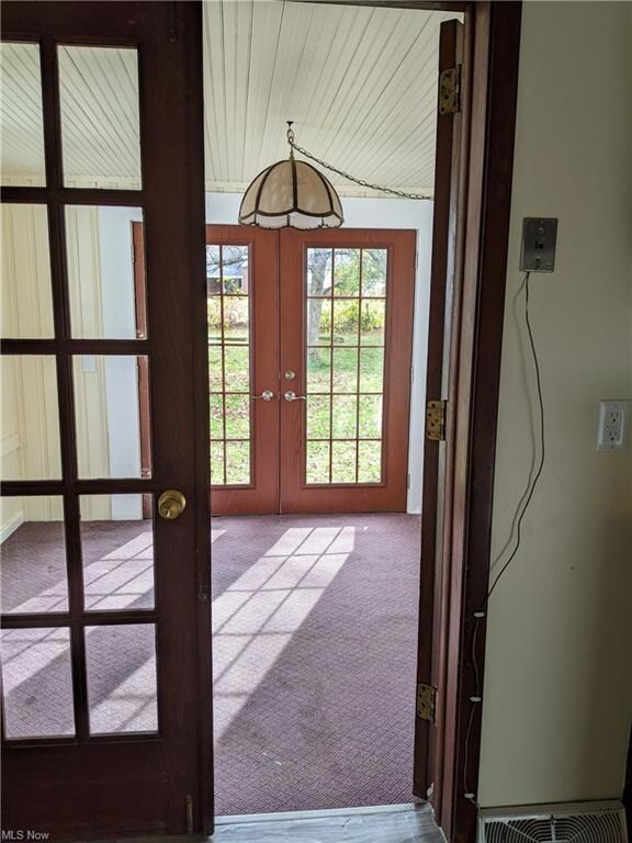 The enclosed back porch, overlooking the spacious 