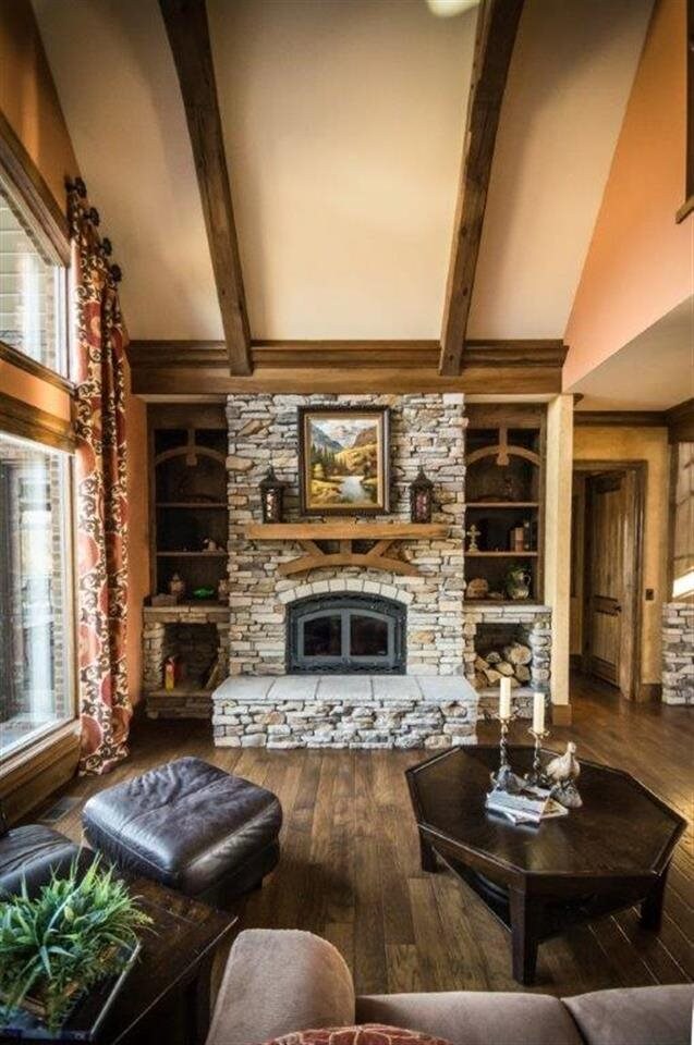 A captivating stone fireplace makes the great room