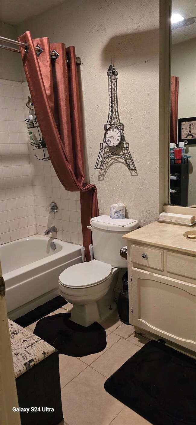 Full bathroom with tile patterned flooring, vanity