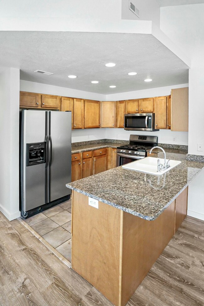 Kitchen with wood cabinets