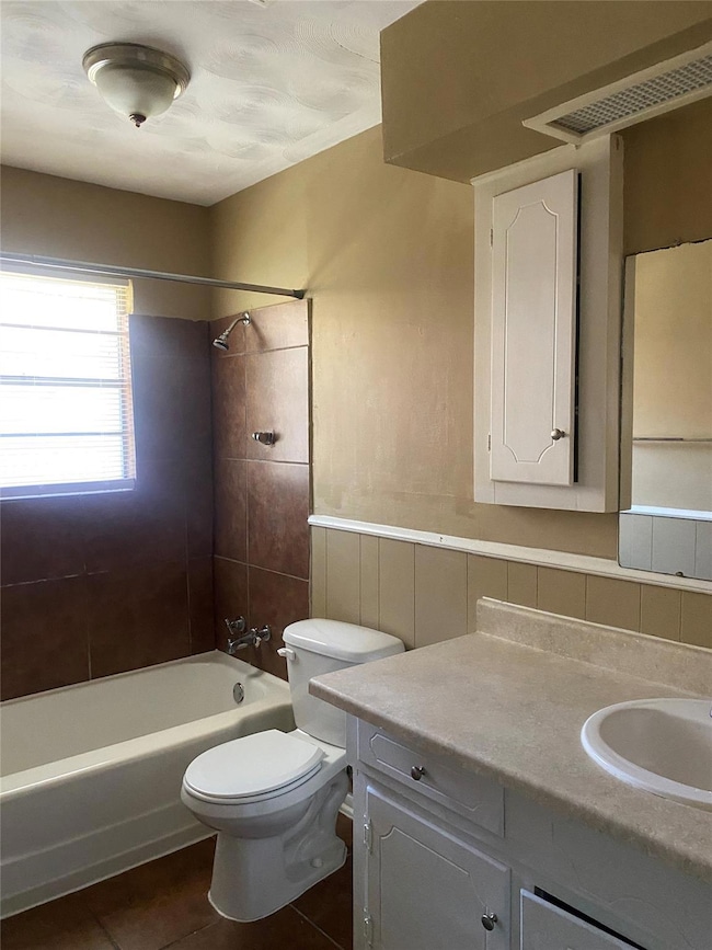 Bathroom featuring toilet, tile patterned floors, 