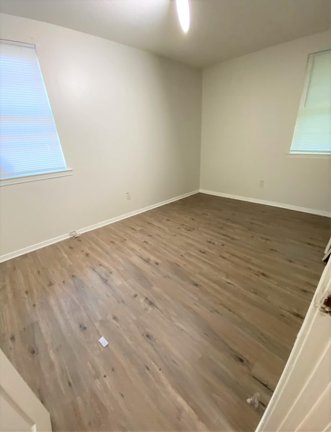 Empty room featuring hardwood / wood-style floors