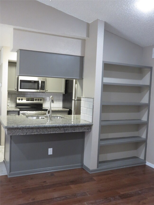 View of Full Kitchen from Living Room.  Built-In B