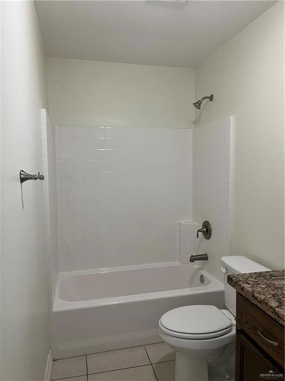 Full bathroom with tile patterned flooring,  shower combination, vanity, and toilet