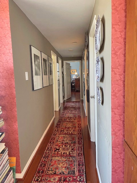 Hallway with bedrooms on left;  primary at the end