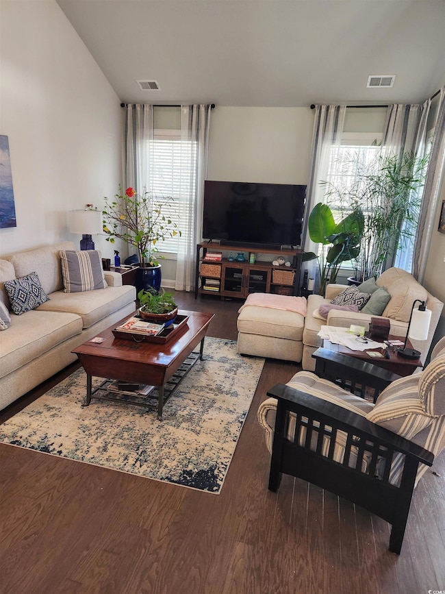 Living area featuring wood finished floors and plenty of natural light