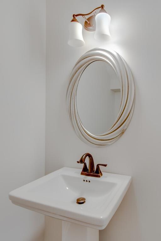 Powder room located off of the kitchen area