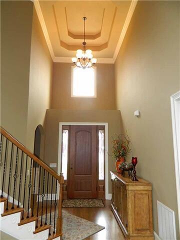 Spacious grand entry foyer with double trey ceilin