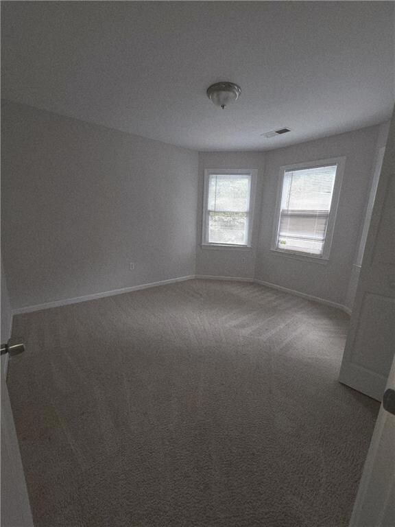 Empty room featuring carpet flooring