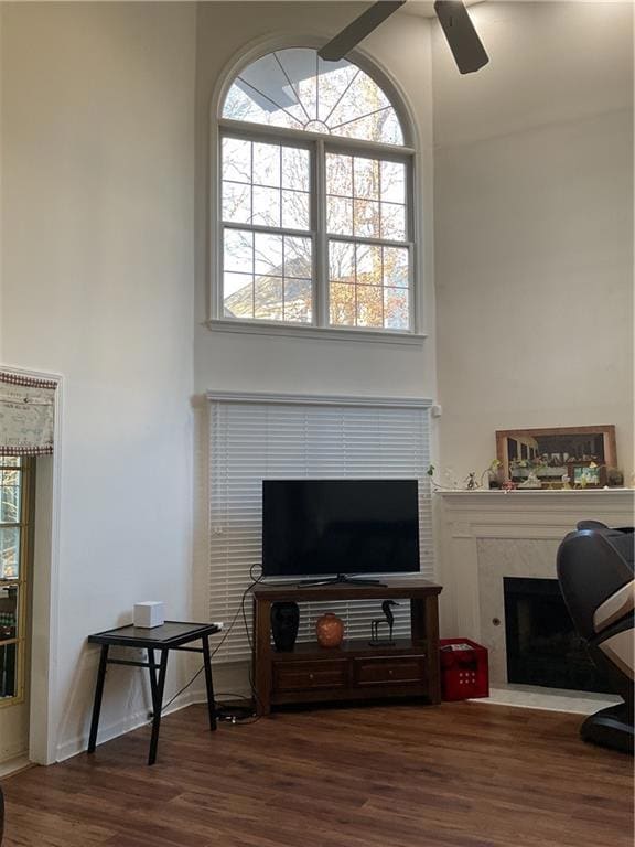 Office area with a high end fireplace, dark hardwo