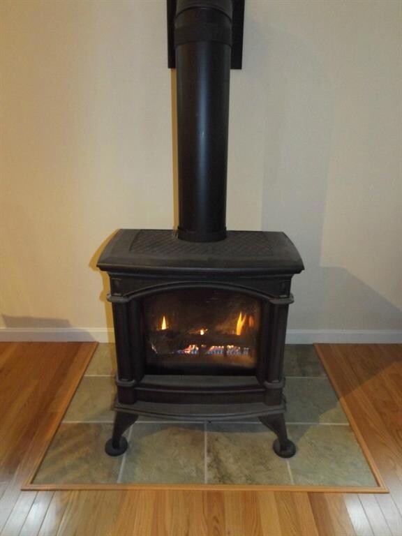 Propane fireplace in living room.