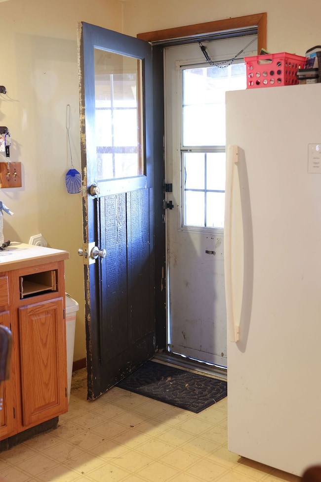 Doorway with tile patterned floors