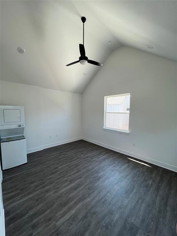 Bonus room featuring stacked washer / dryer, vaul