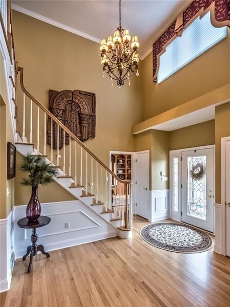 Covered entry leads to dramatic 2 story foyer whic