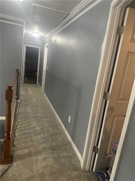 Hall with an upstairs landing, baseboards, dark ca